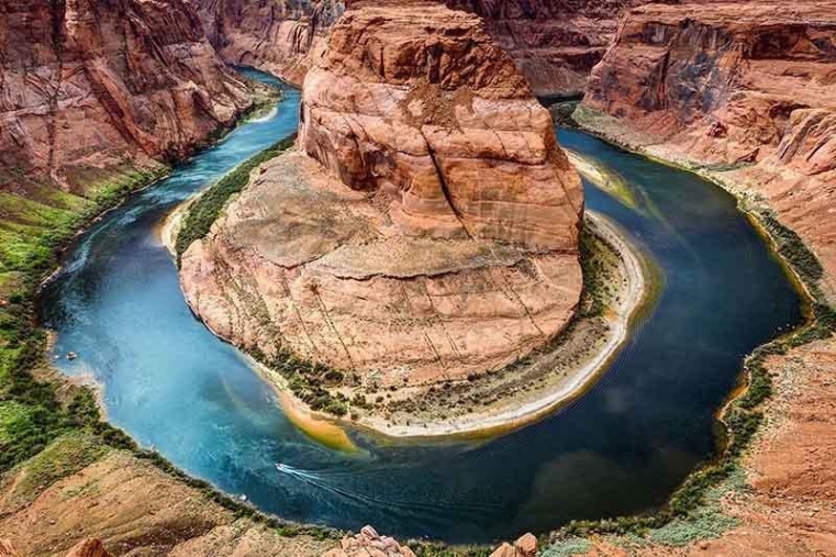 Not only is Lake Powell’s water level plummeting because of drought, its total capacity is shrinking, too